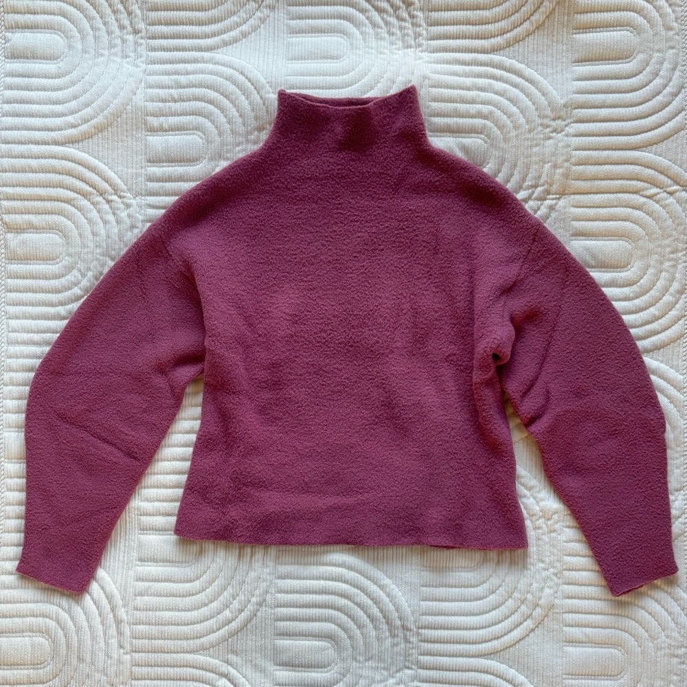 Bubblegum pink bubble-sleeved mock neck sweater